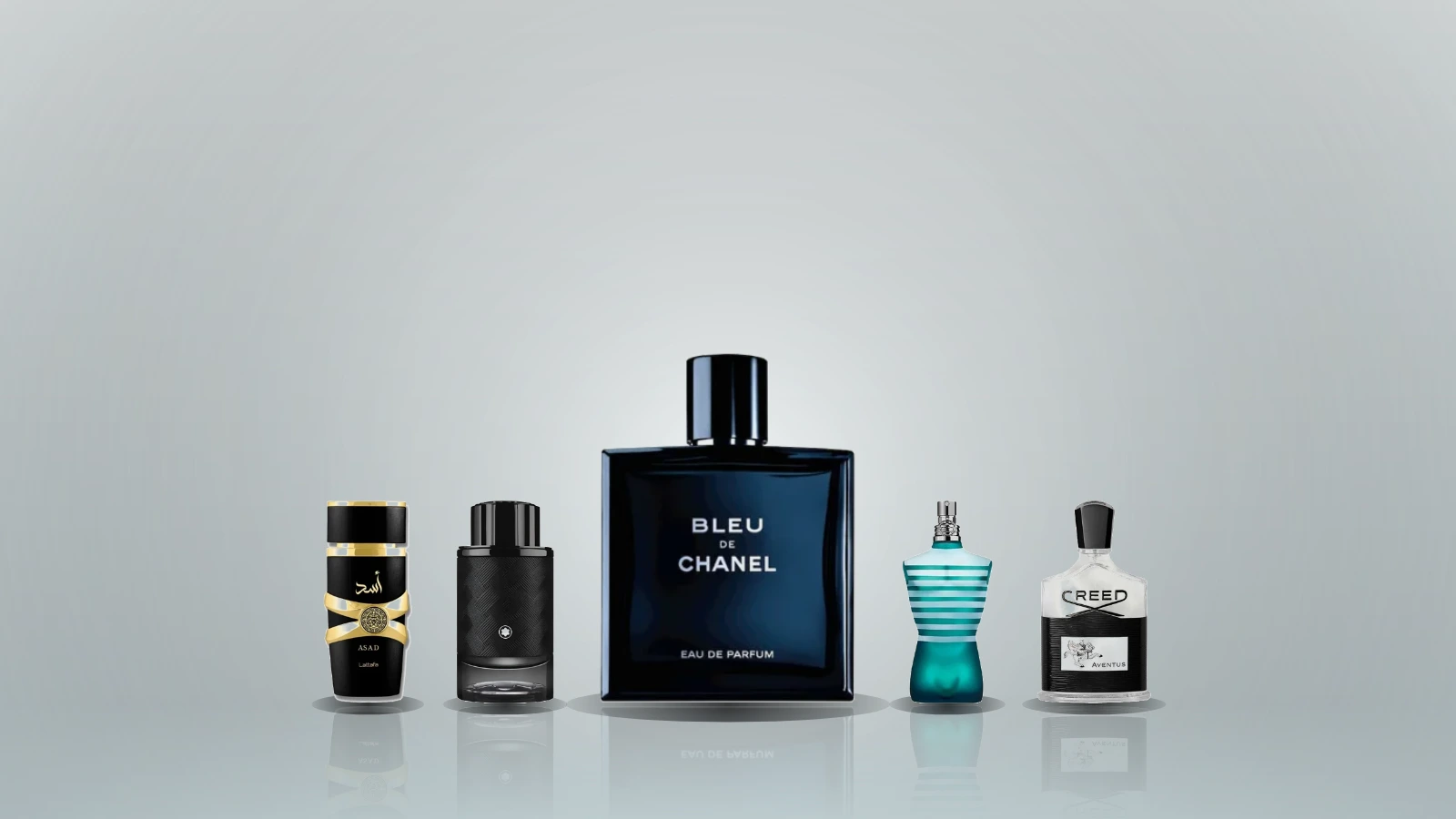 Twelve men's fragrance bottles arranged on dark marble, including Bleu de Chanel, Dior Sauvage, Creed Aventus, Le Male, Terre d'Hermes and Armaf Club de Nuit Intense Man