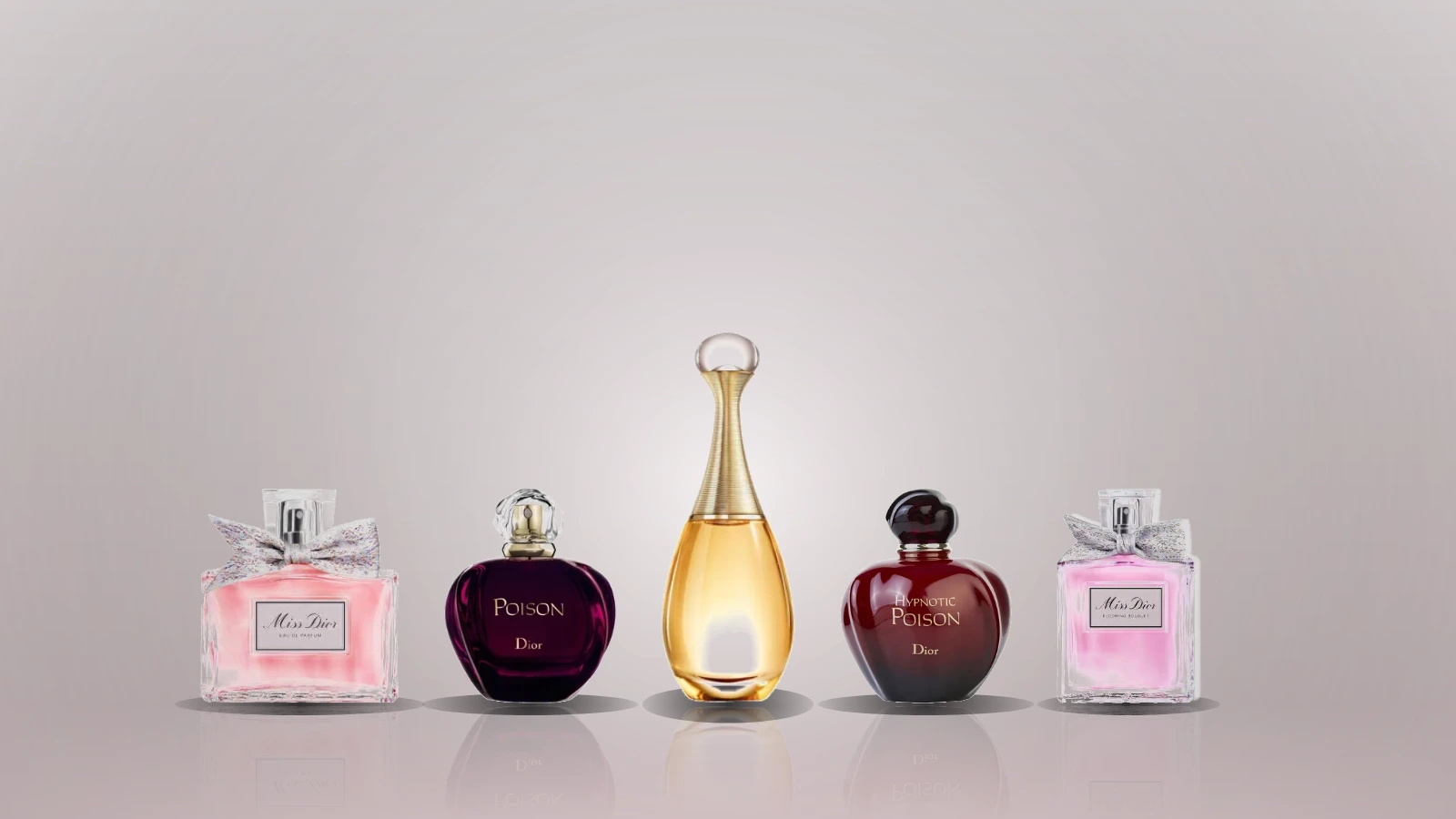 Dior women's fragrance bottles including J'adore, Miss Dior, Poison, Hypnotic Poison and Addict on a marble surface