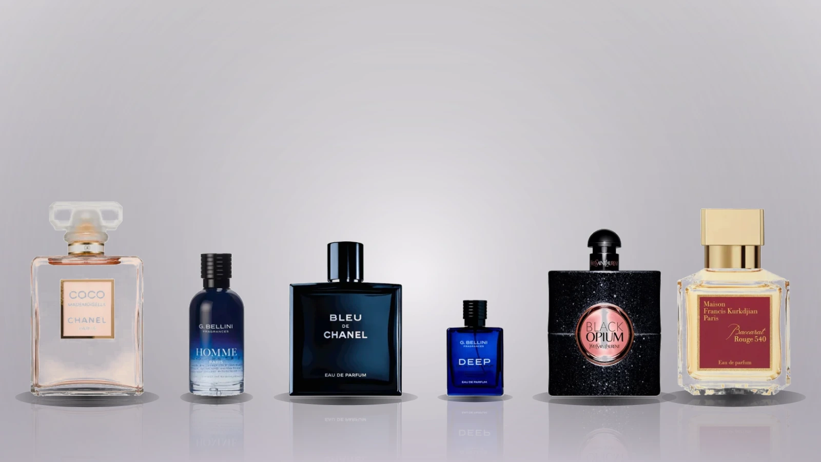 Six perfume bottles labelled Lacura and Suddenly are arranged on a marble and wooden surface with soft lighting and floral accents